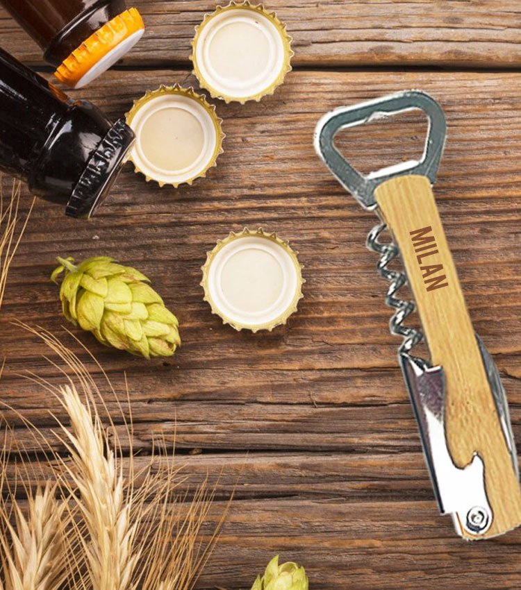 Waiter's knife engraved with name at a wooden base with beer bottles and caps