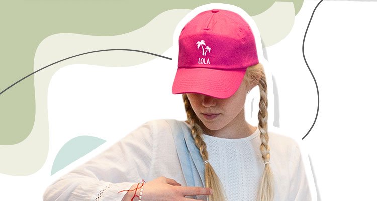 Girl with pink cap with name and palm trees on a print background