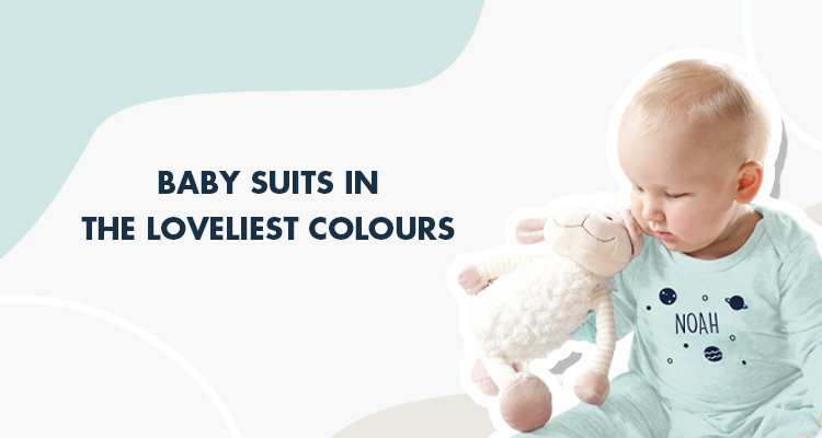 Baby wears mint colored baby suit printed with planets and own name